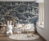Nursery decor featuring a blue wildlife wall mural and a white toy rabbit.