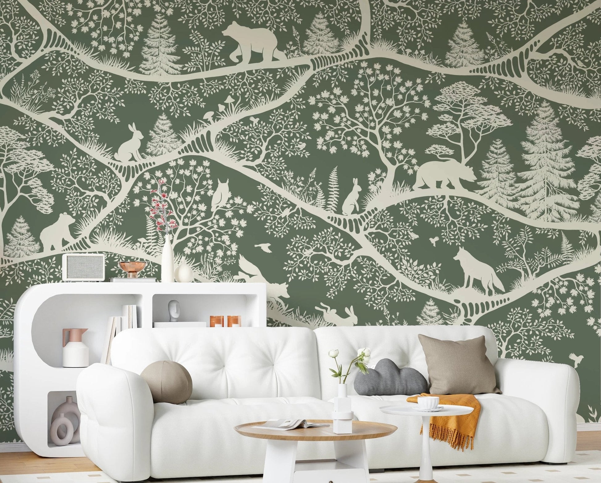 Green forest wall mural with bears and rabbits behind a white sofa in a living room.