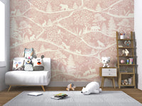 Minimalist nursery wall mural with pink forest illustrations and a small white armchair.