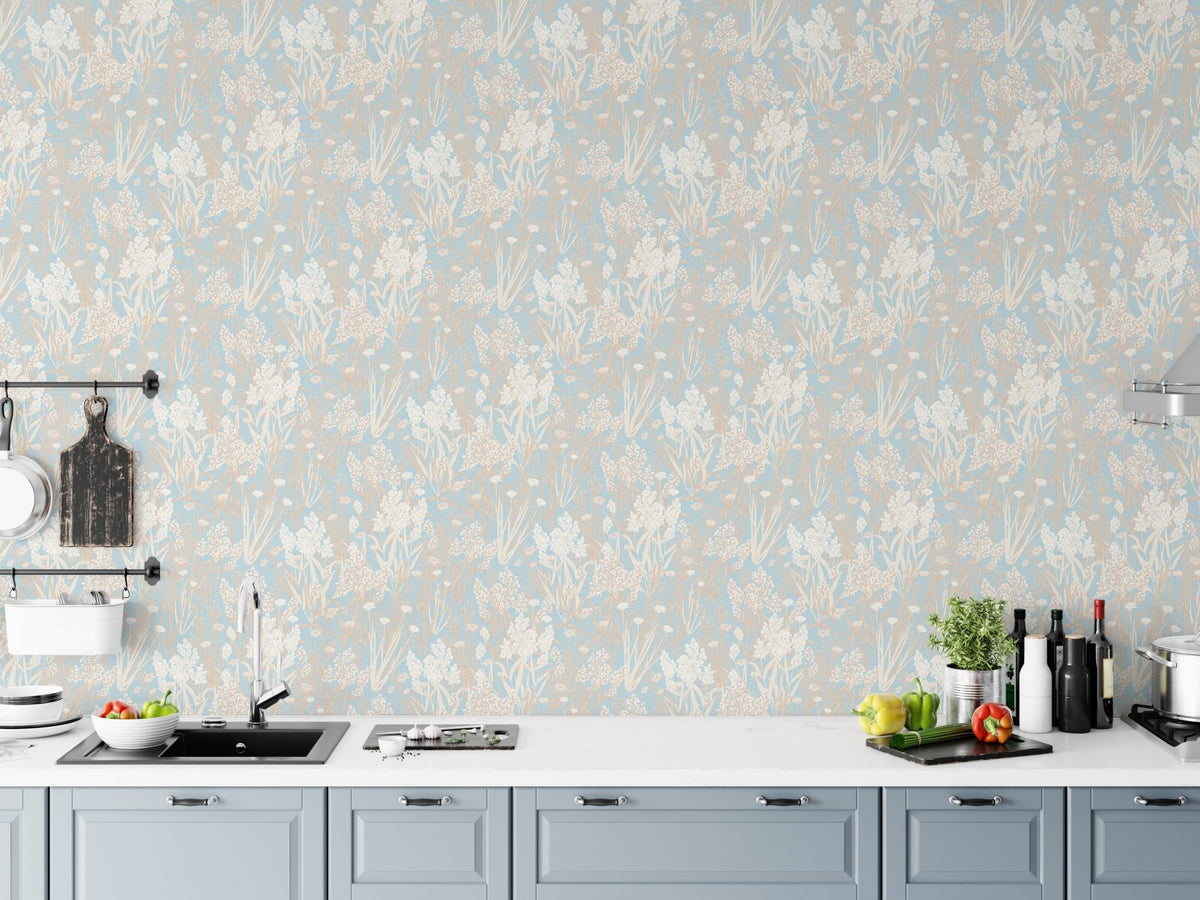 Blue and beige leaf wallpaper behind a modern kitchen counter setup.