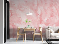 Abstract pink feather wallpaper behind a wooden dining table