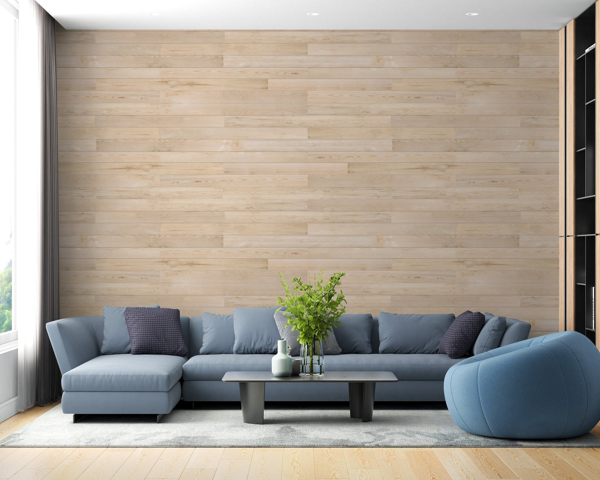 Living room with Oakwood Wonder Wallcovering wallpaper and blue sofa.