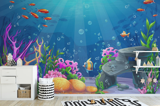 Vibrant coral reef ocean wall mural behind a white media console and indoor plants.