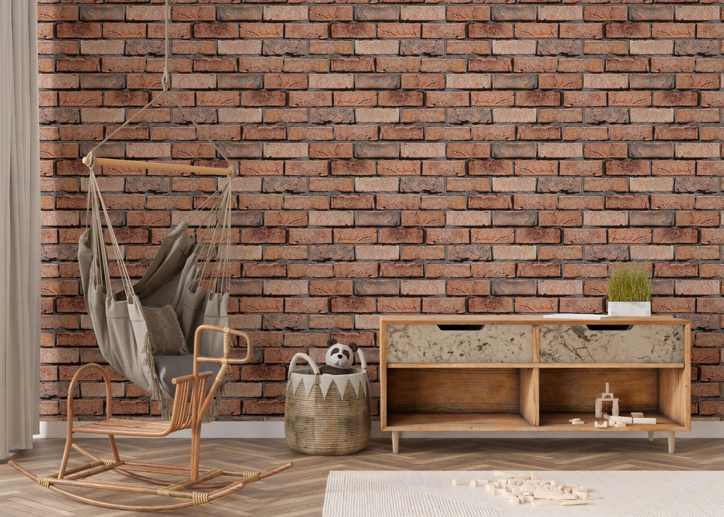 Weathered red brick wallpaper in a nursery area with a hanging wicker chair