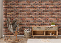 Weathered red brick wallpaper in a nursery area with a hanging wicker chair