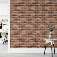 Faux brick wallpaper on a hallway wall next to a wooden side table