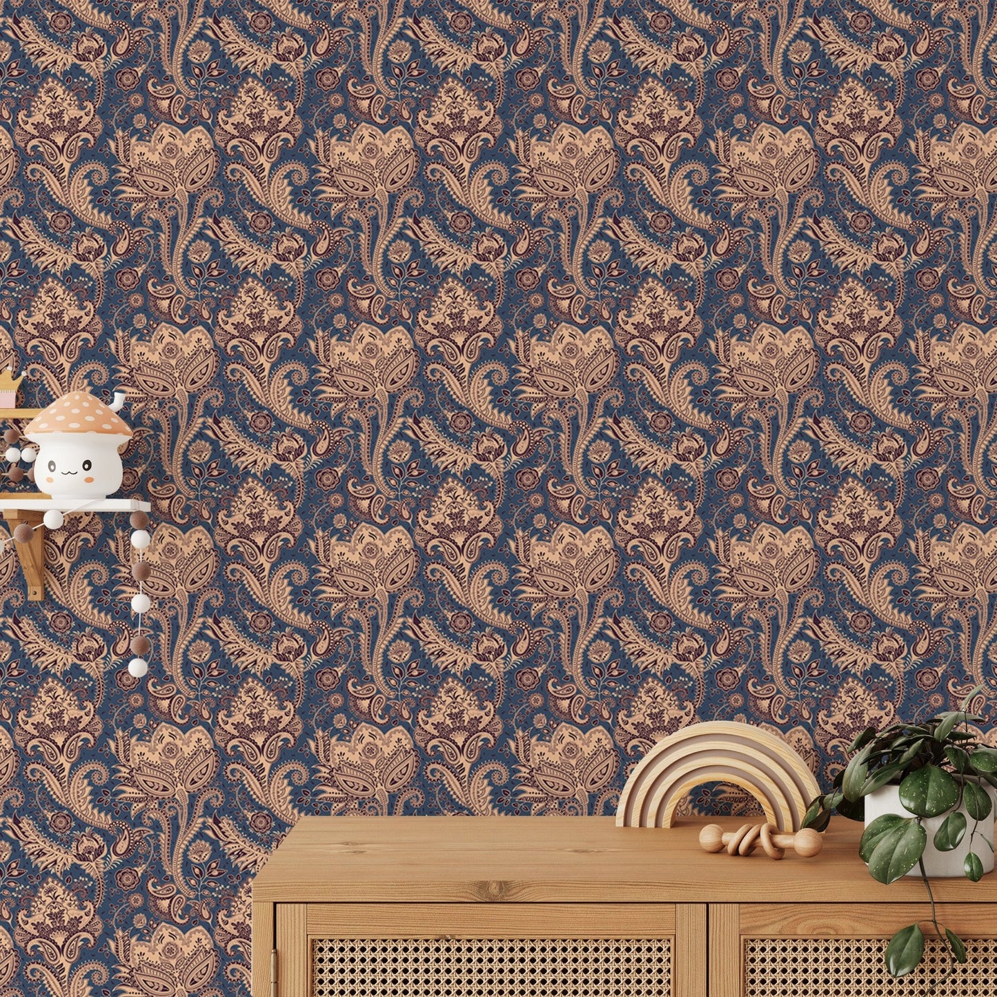 Brown and blue paisley wallpaper behind wooden side table in kids area.