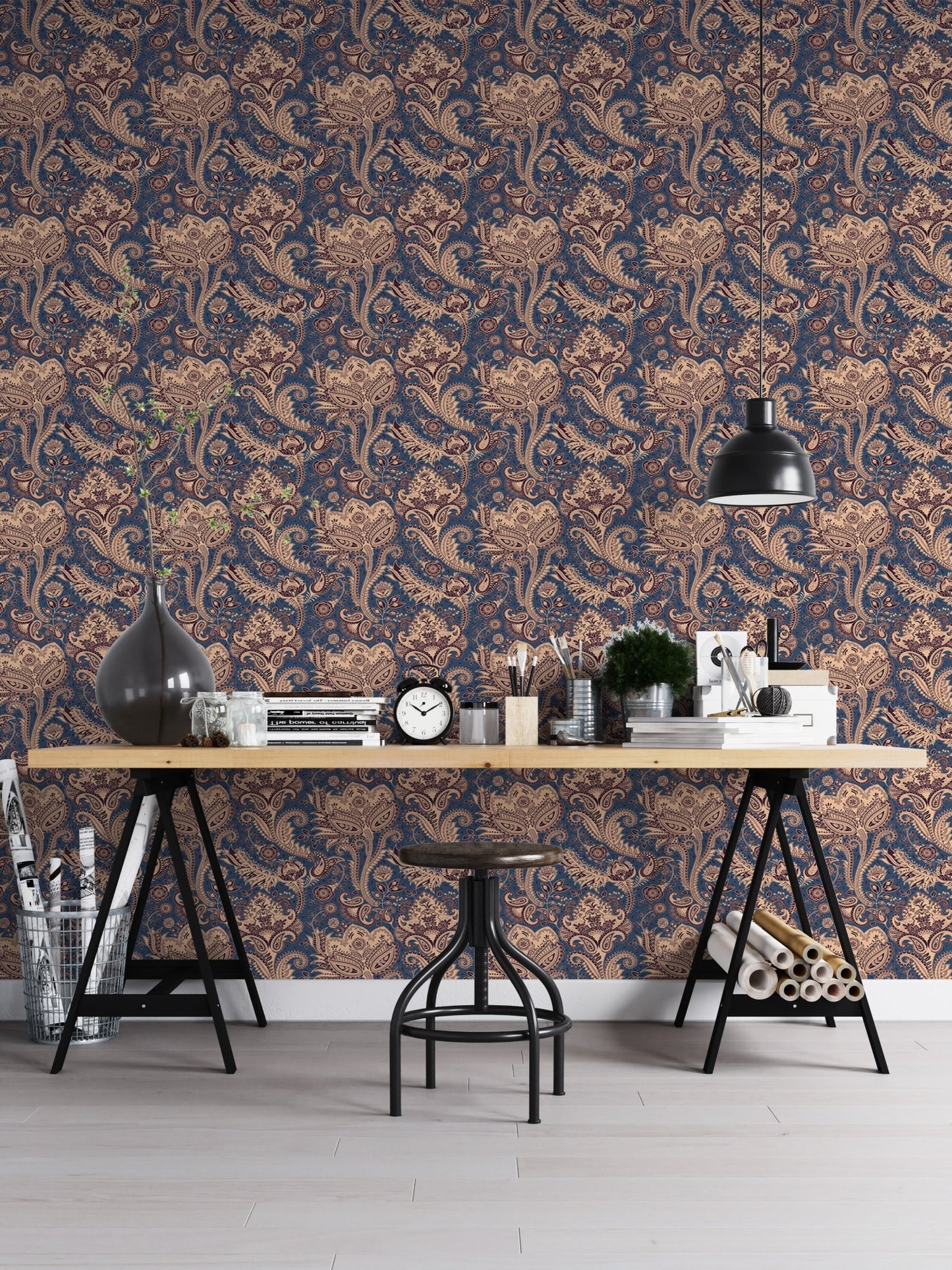 Retro floral wallpaper in home office with wooden desk and black lamp.