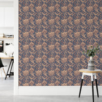 Indian floral pattern wallpaper in minimalist workspace with wooden stool.