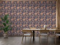 Old retro paisley wallpaper in spacious dining room with wooden furniture.
