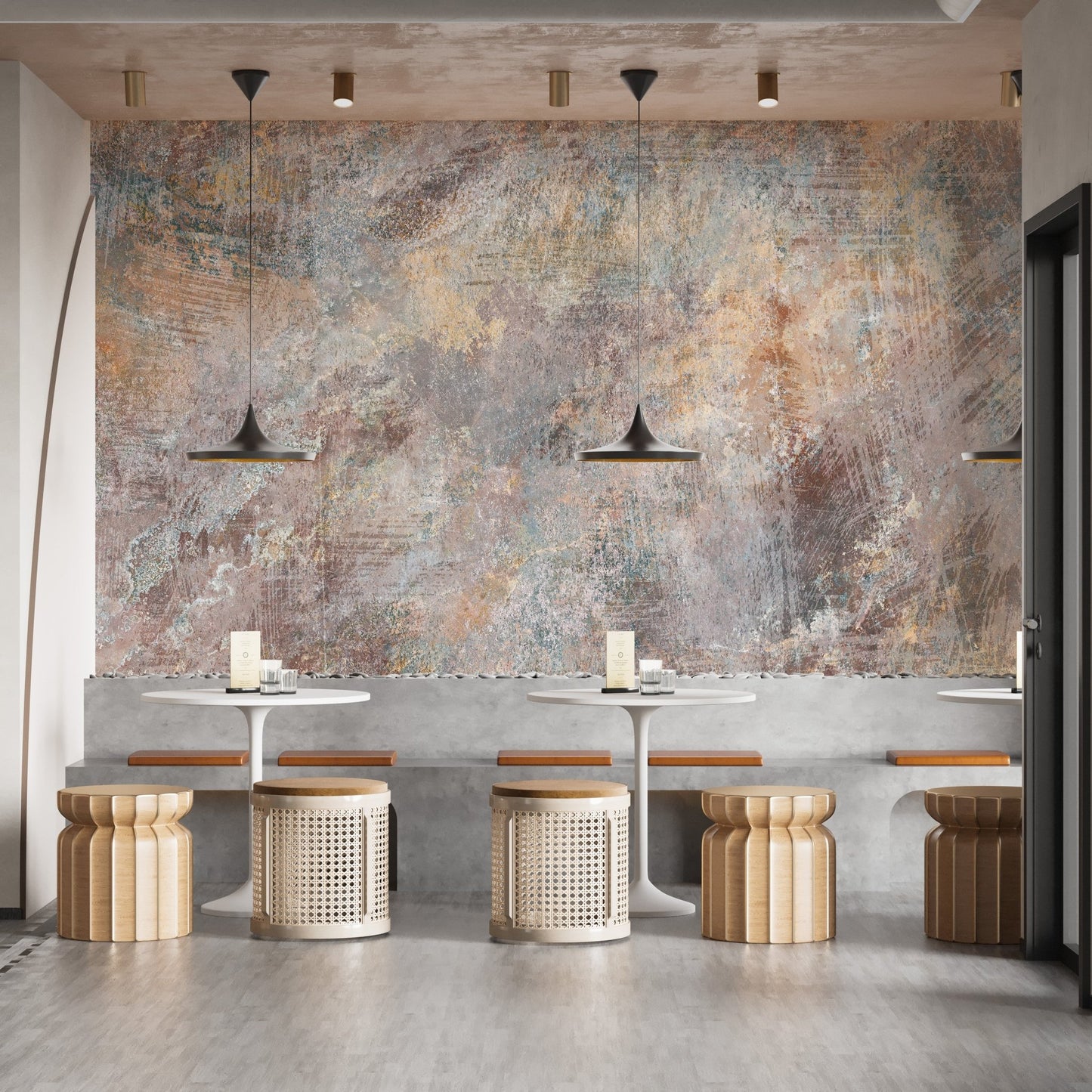 Industrial style concrete wall mural behind wooden stools in a modern restaurant.