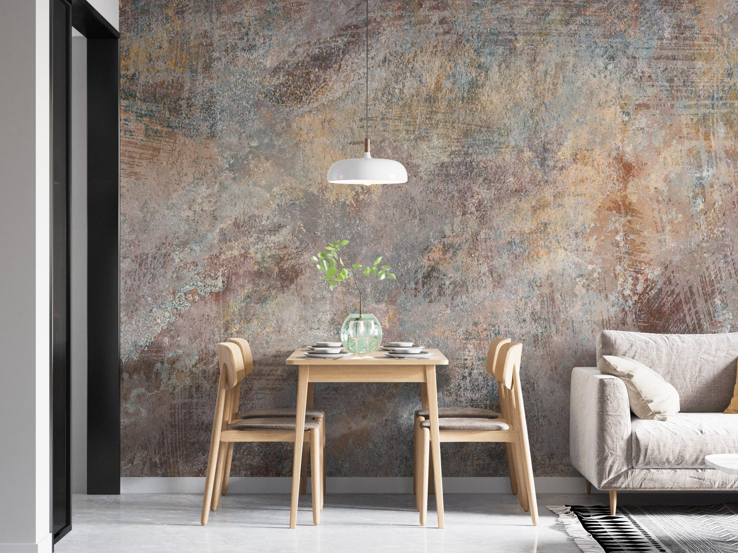 Textured stone wall mural behind a small dining table and white sofa in a flat.