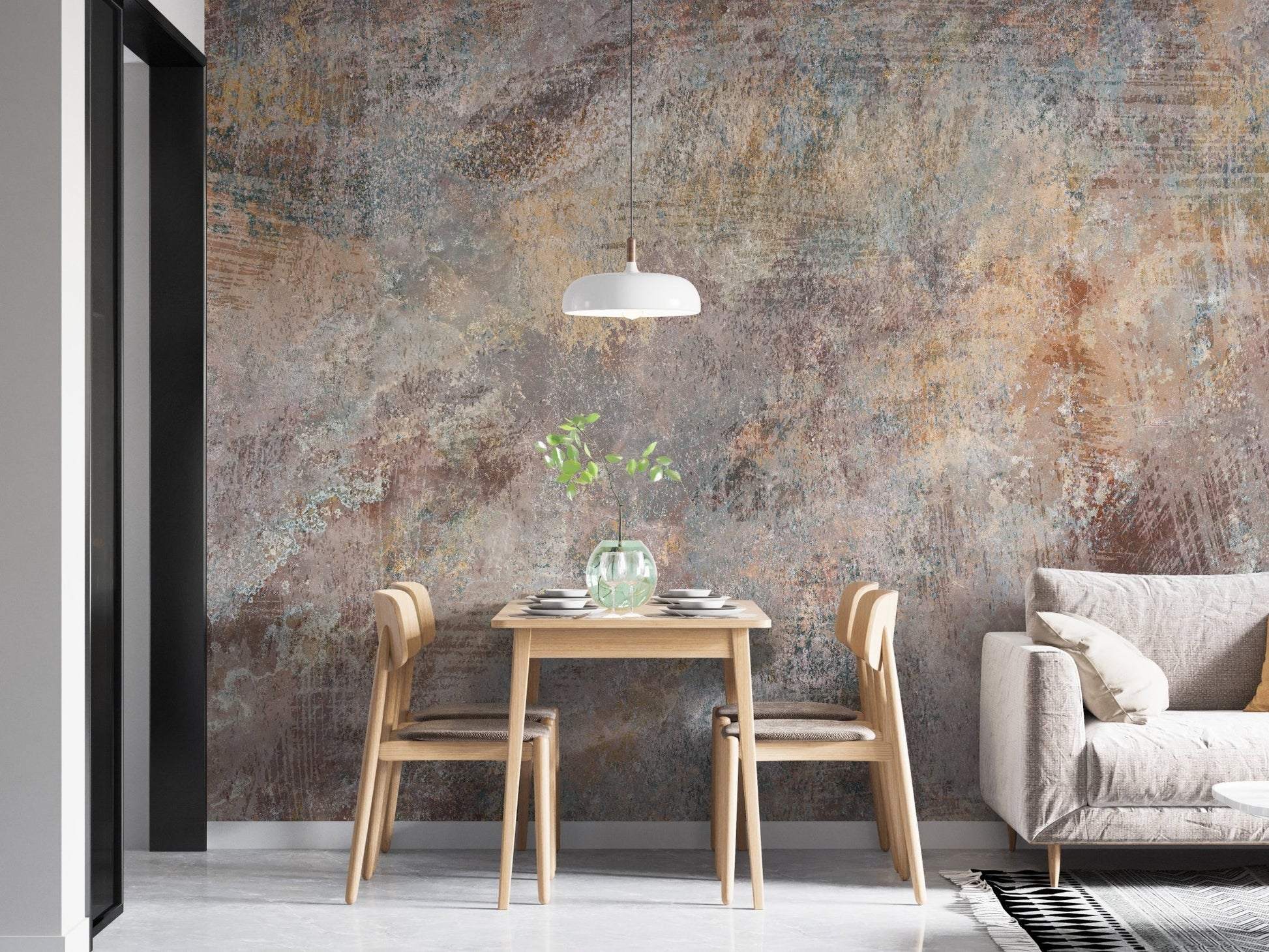 Textured stone wall mural behind a small dining table and white sofa in a flat.