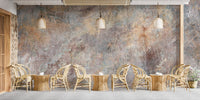 Old Rustic Concrete Stone Wall Mural in a cafe with wooden chairs and warm lighting.