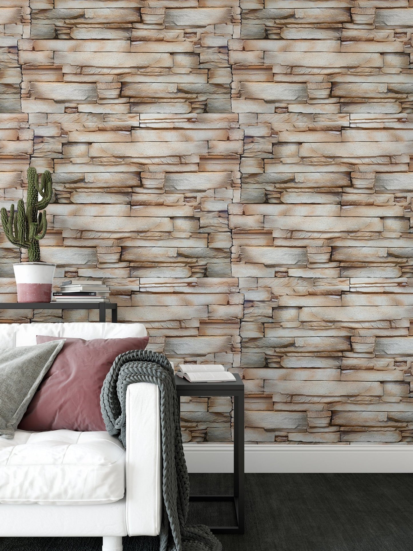 Textured sandstone wallpaper behind a white sofa in a bright living room.