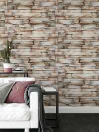 Textured sandstone wallpaper behind a white sofa in a bright living room.