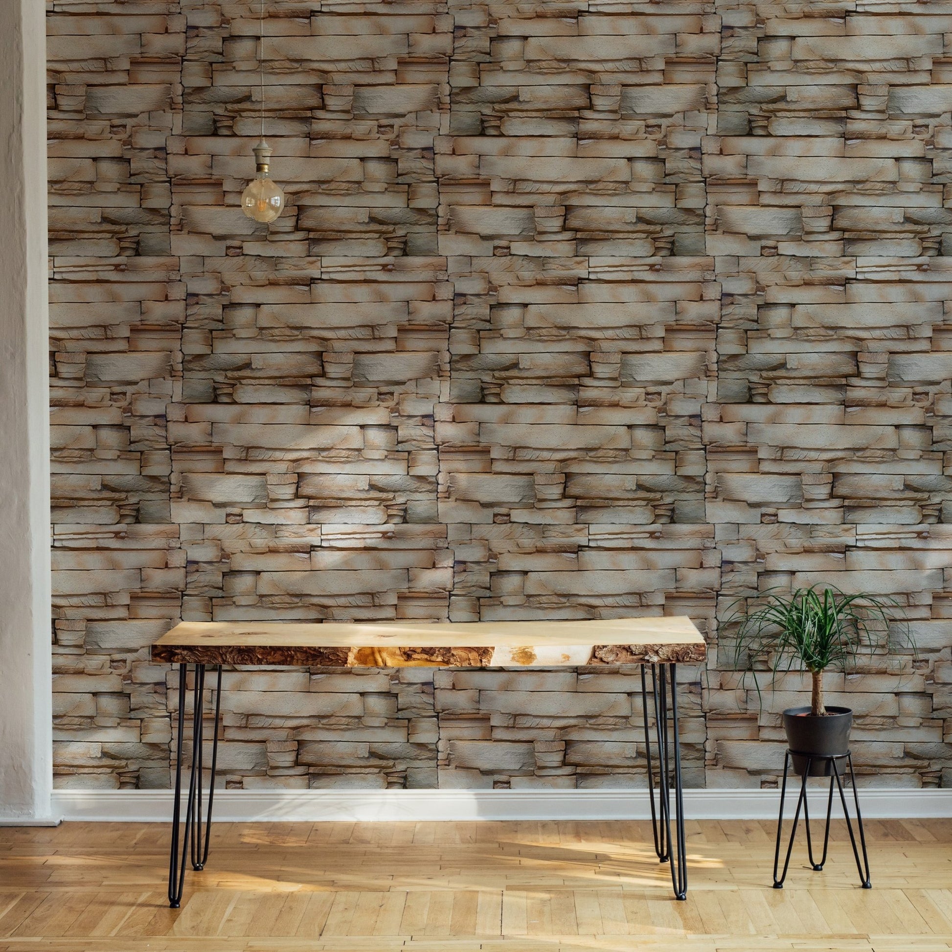 Realistic stone wallpaper behind a wooden desk in a home office setup.