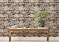 Horizontal stone block wallpaper in a minimalist room with a low bench.