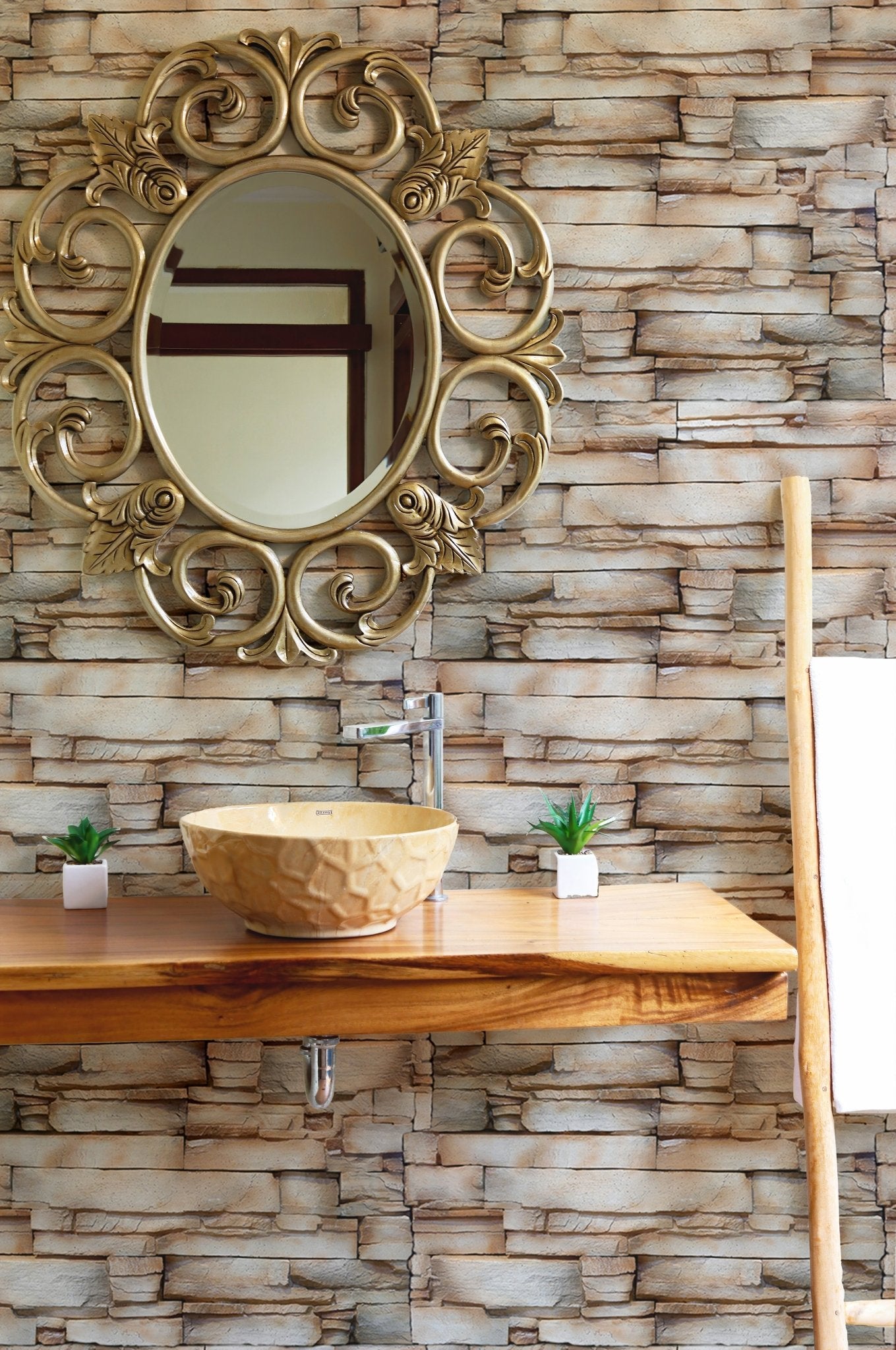Vintage sandstone wallpaper used as a backdrop for a wooden vanity and mirror.