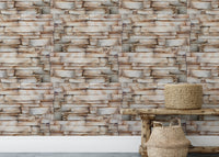 Rustic stone wallpaper behind a wooden bench and woven baskets.