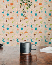 Dining area wall mural in vintage style with a dark coffee mug on a wooden table foreground.