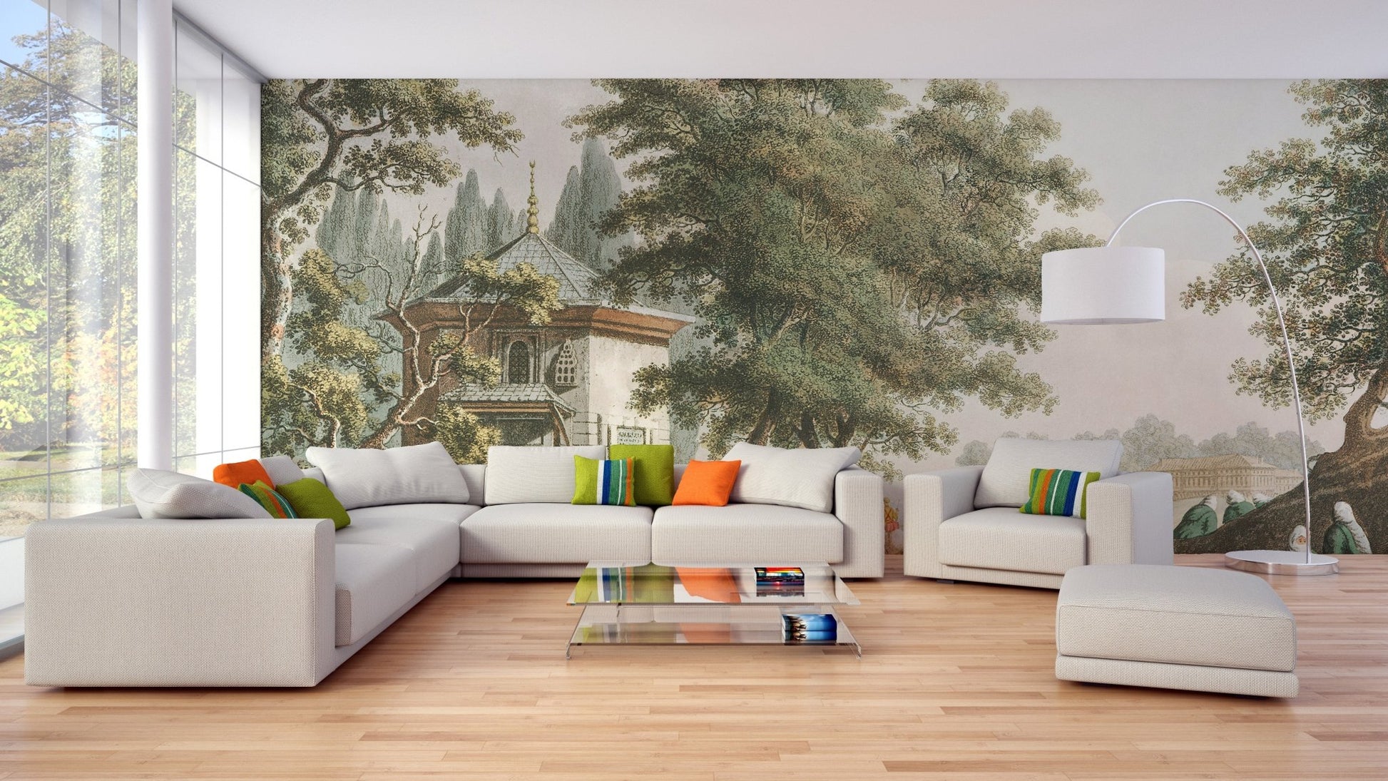 Landscape village wall mural with large green trees and white sofa in modern living area.