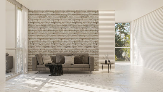 Spacious living area with a large feature wall using white brick wallpaper design.