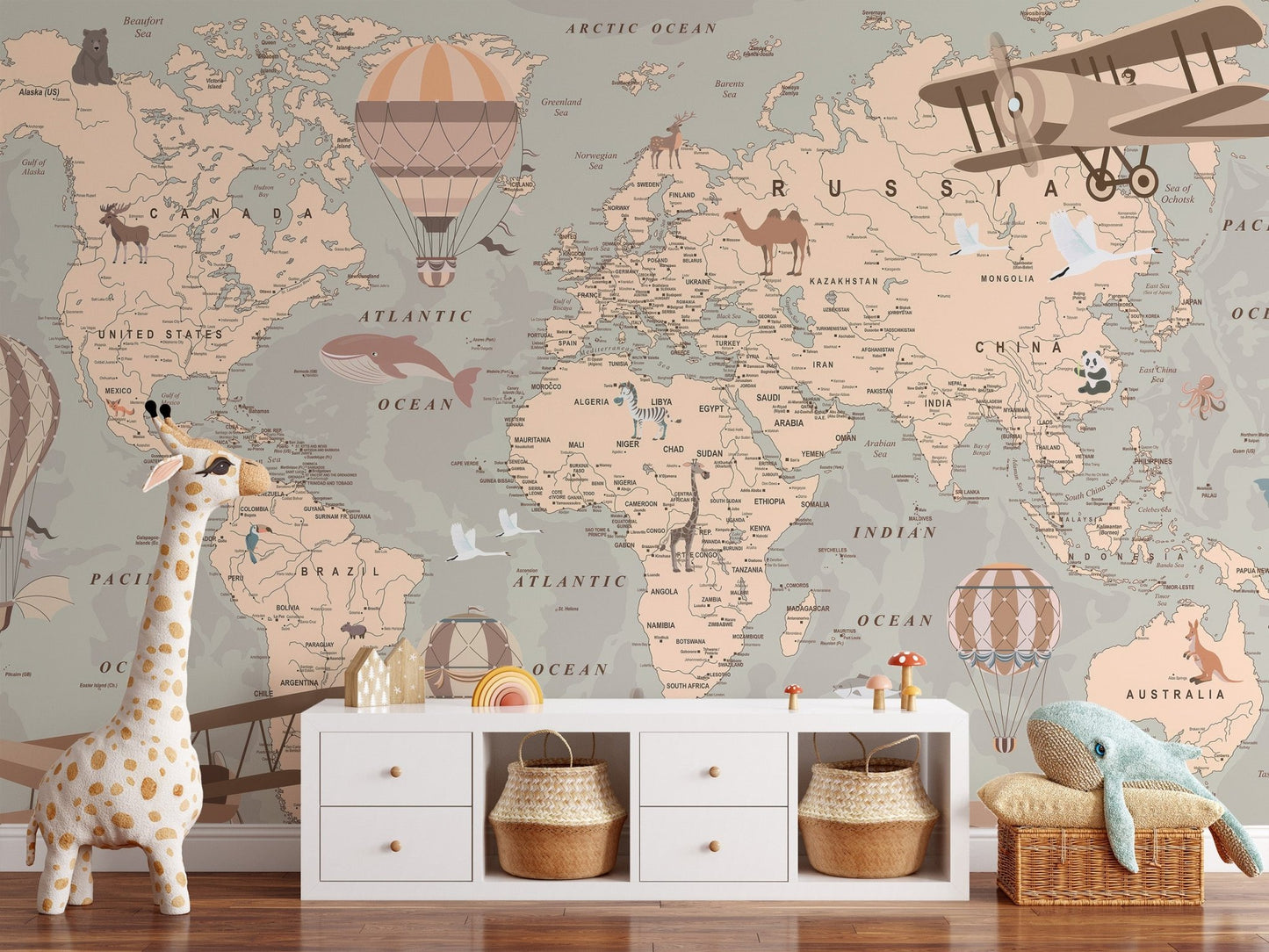 Earth toned map mural with land animals and nautical elements.