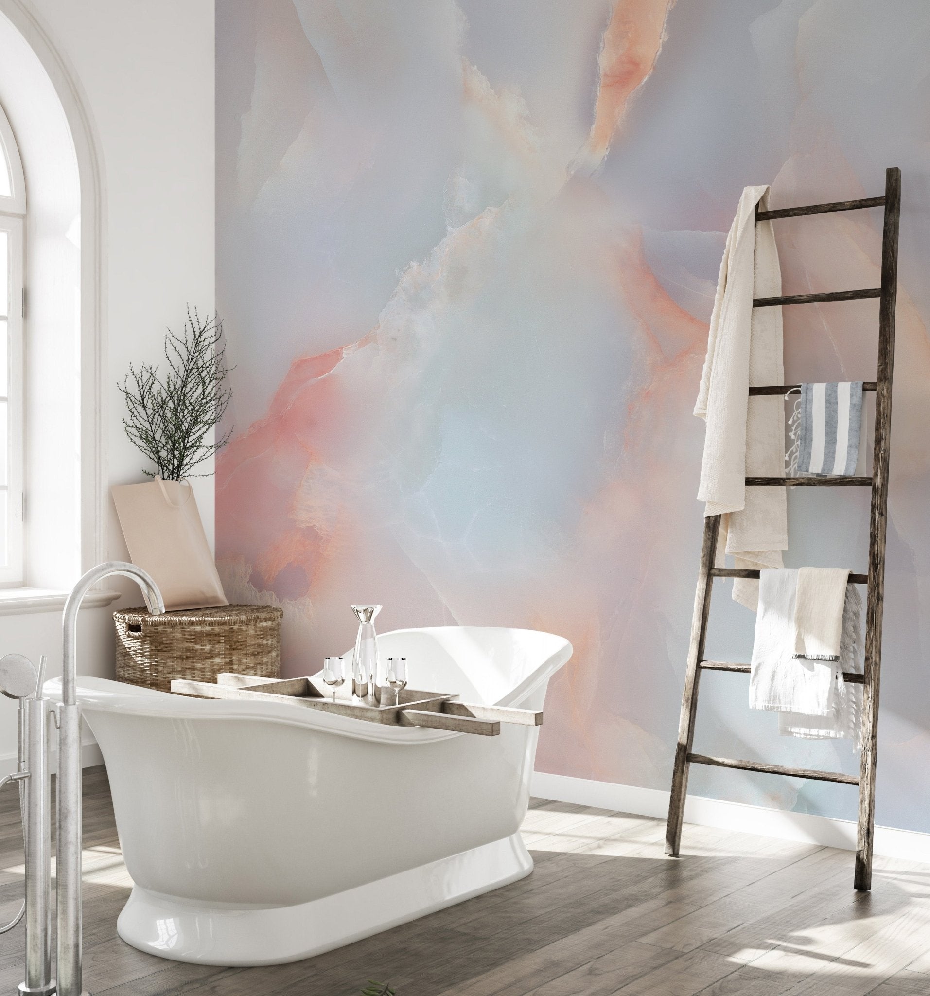 Wall mural with pink and blue marble textures behind a white soaking tub.