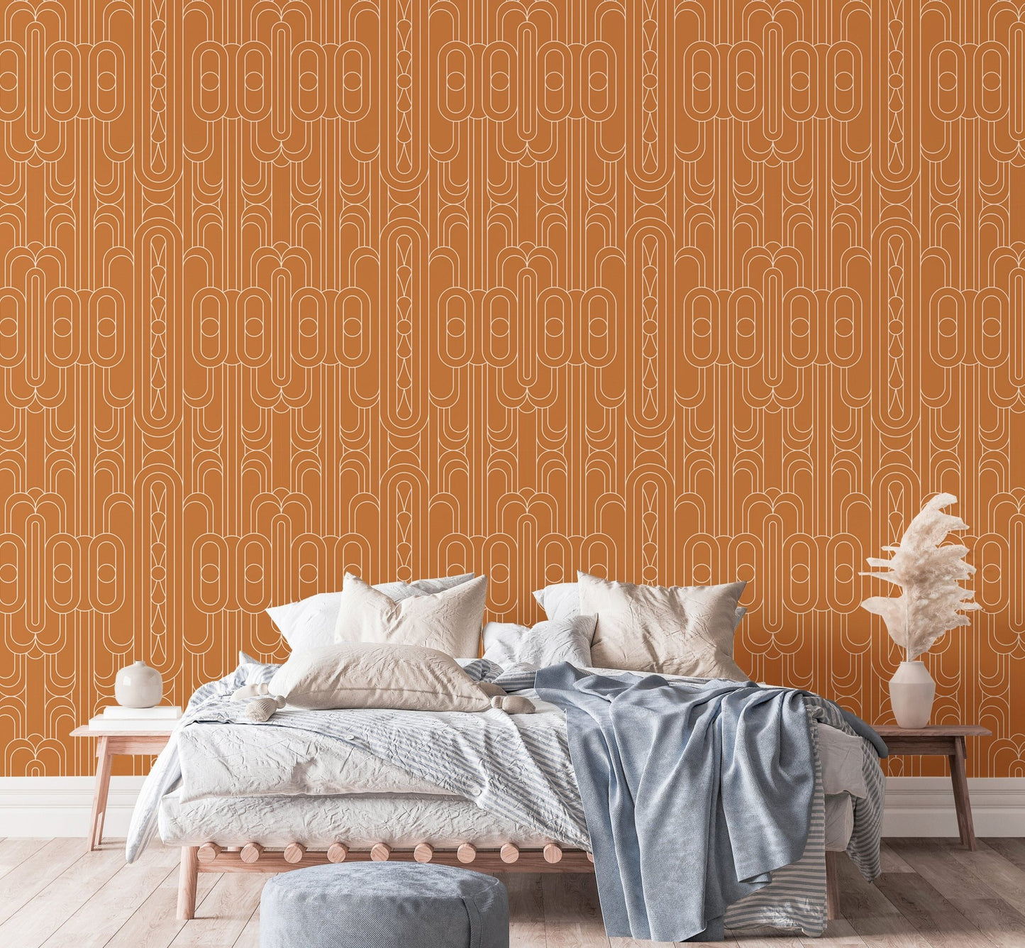 Geometric linear wallpaper in a bedroom setting behind a white bed 