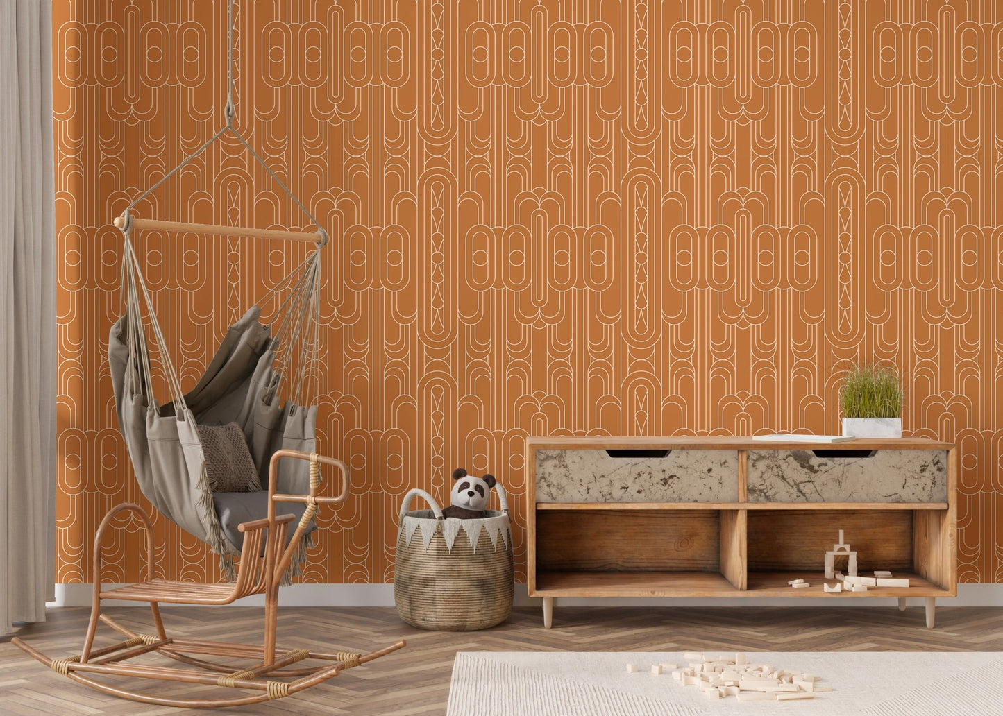 Minimalist orange wallpaper design in a cozy nursery corner with a swing chair.