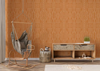 Minimalist orange wallpaper design in a cozy nursery corner with a swing chair.
