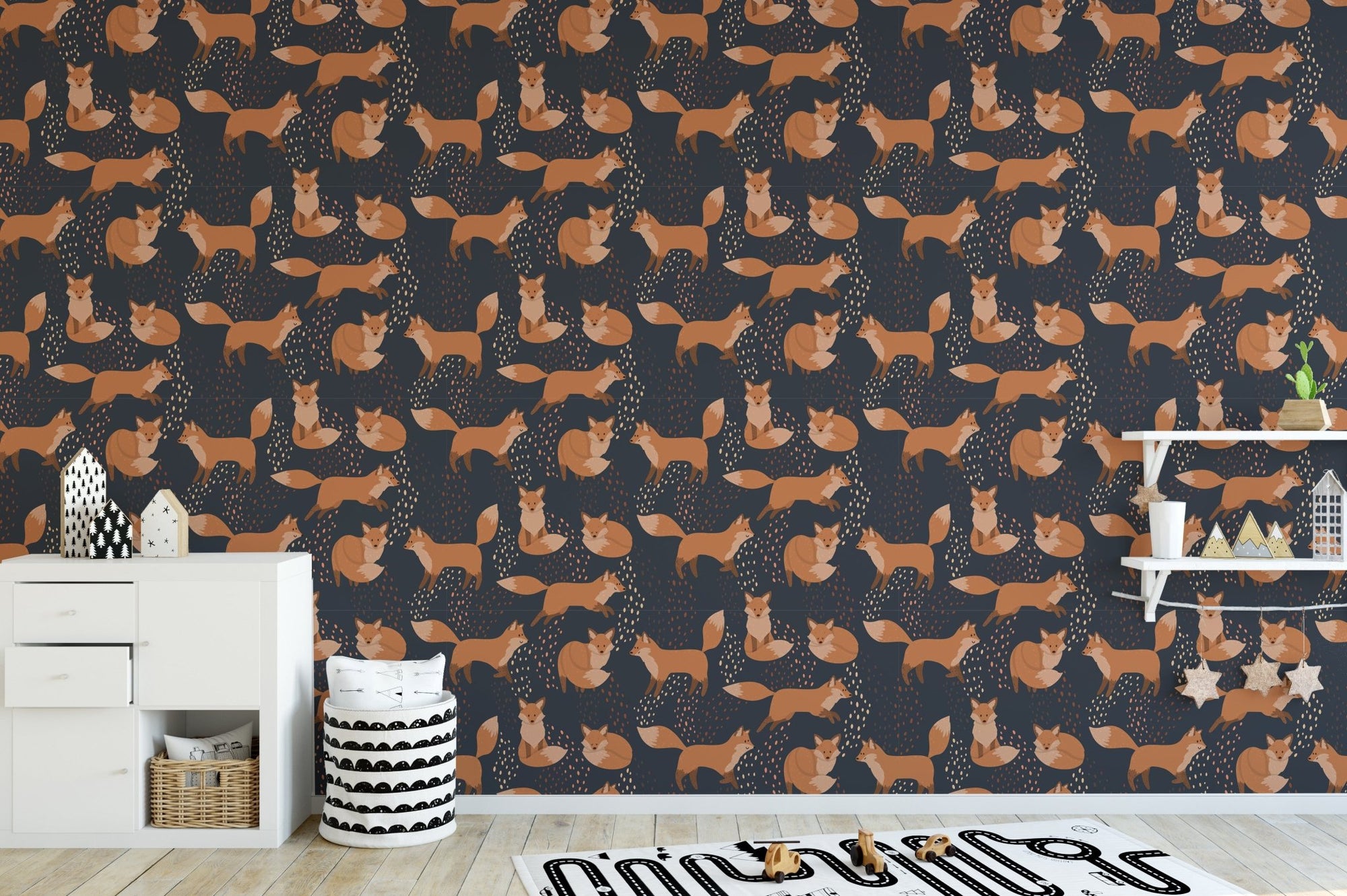 Orange Foxes Fun Removable Wallpaper in a nursery with a white dresser.