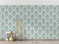 Teal damask wallpaper in a playroom with a wooden ladder and toys.