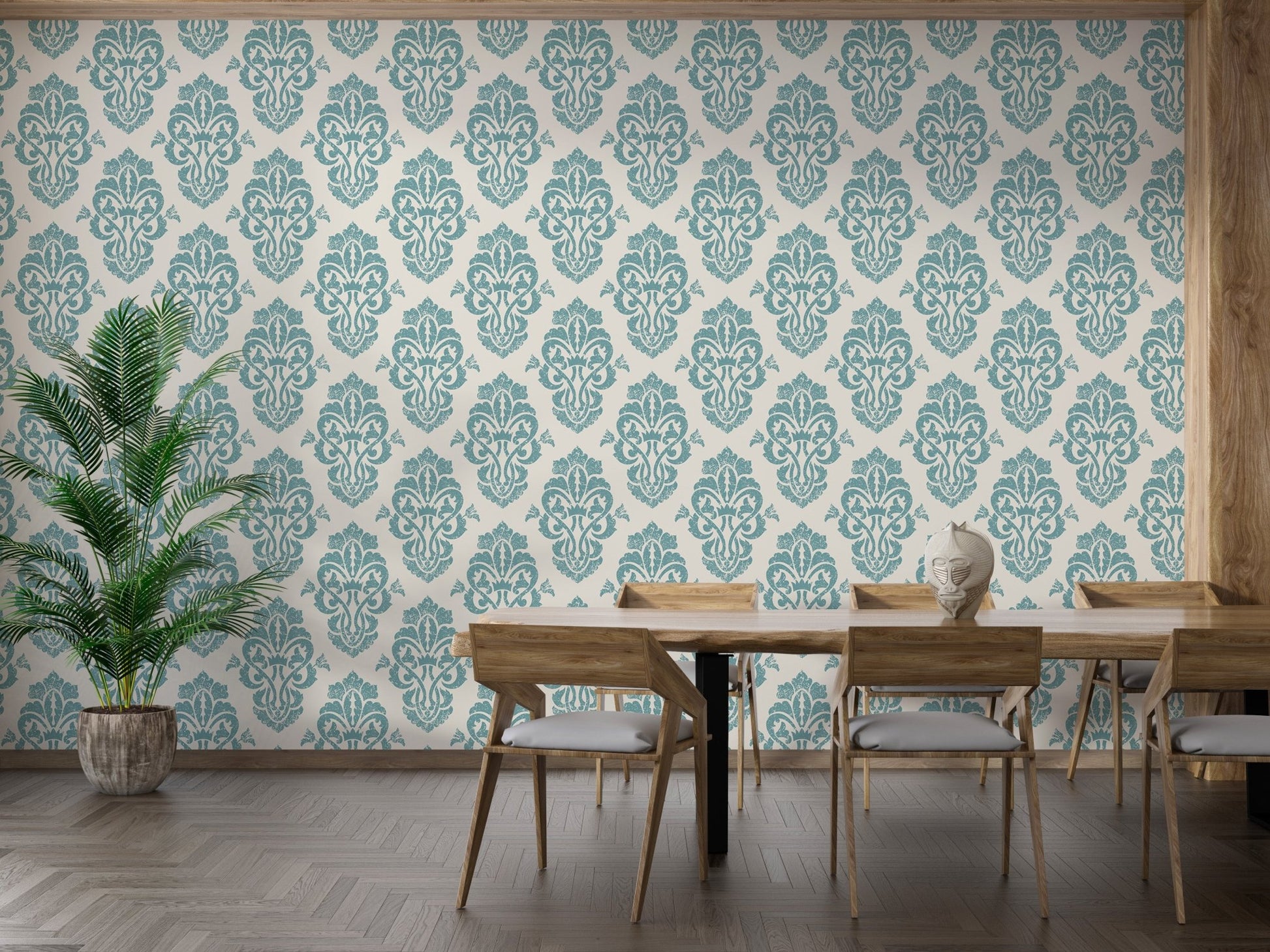 Ornamental damask wallpaper in a dining room with a large wooden table.