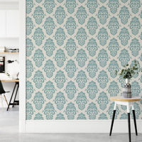 Teal and white ornamental damask delight repeat pattern wallpaper in a hallway.