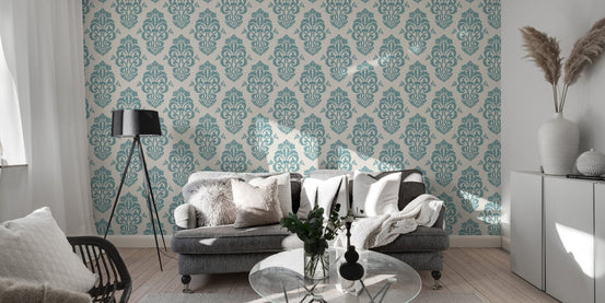 Blue damask wallpaper on a living room feature wall behind a sofa.