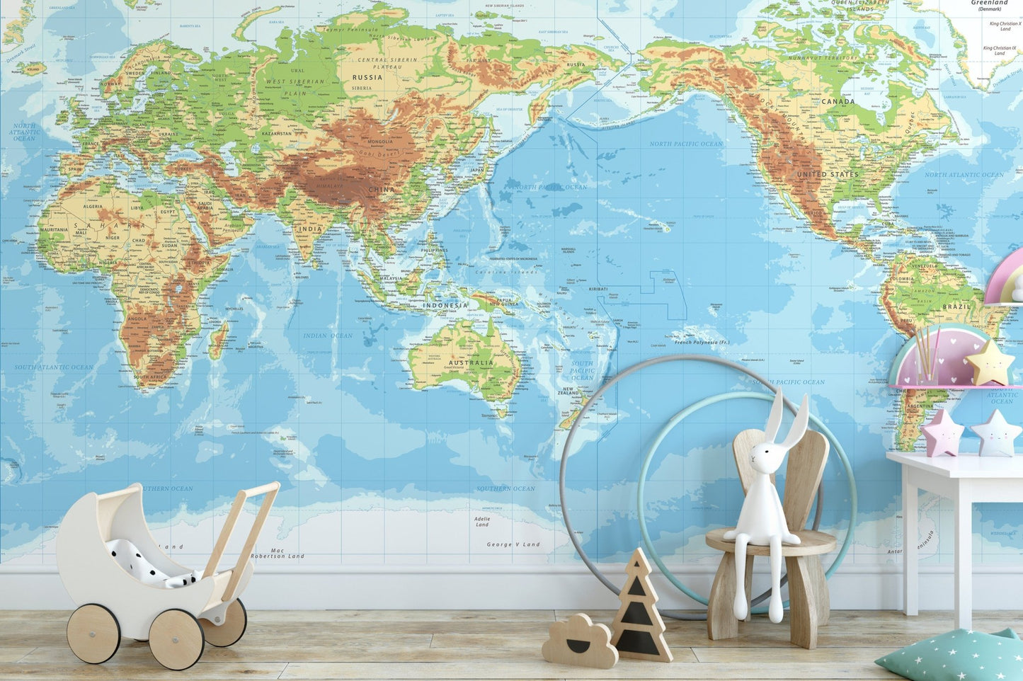 Nursery room with educational world map wall mural in pastel colors