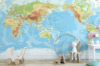 Nursery room with educational world map wall mural in pastel colors