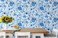 Kitchen dining area wallpaper featuring blue flowers and wooden table.