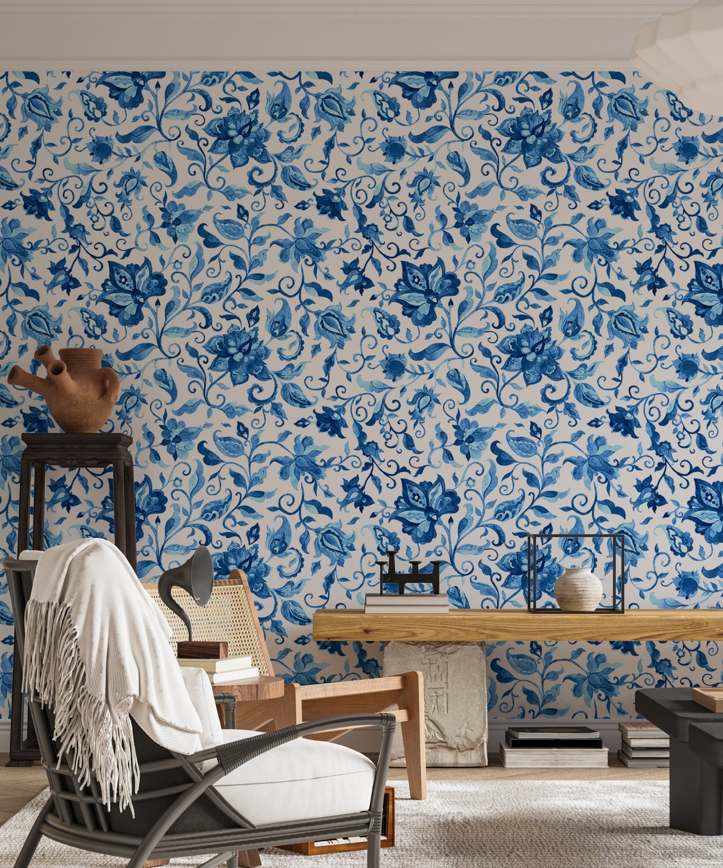 Living room wallpaper with blue paisley pattern and rustic furniture.
