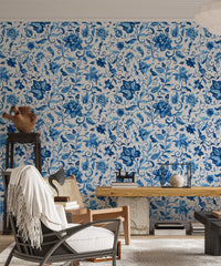Living room wallpaper with blue paisley pattern and rustic furniture.