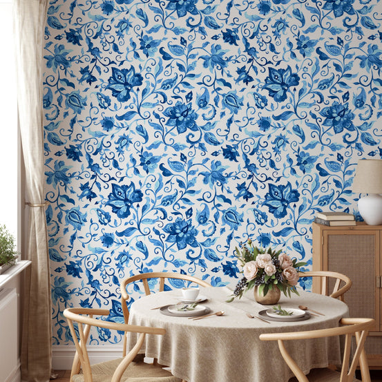 Dining room wallpaper with blue paisley floral pattern and wooden table.