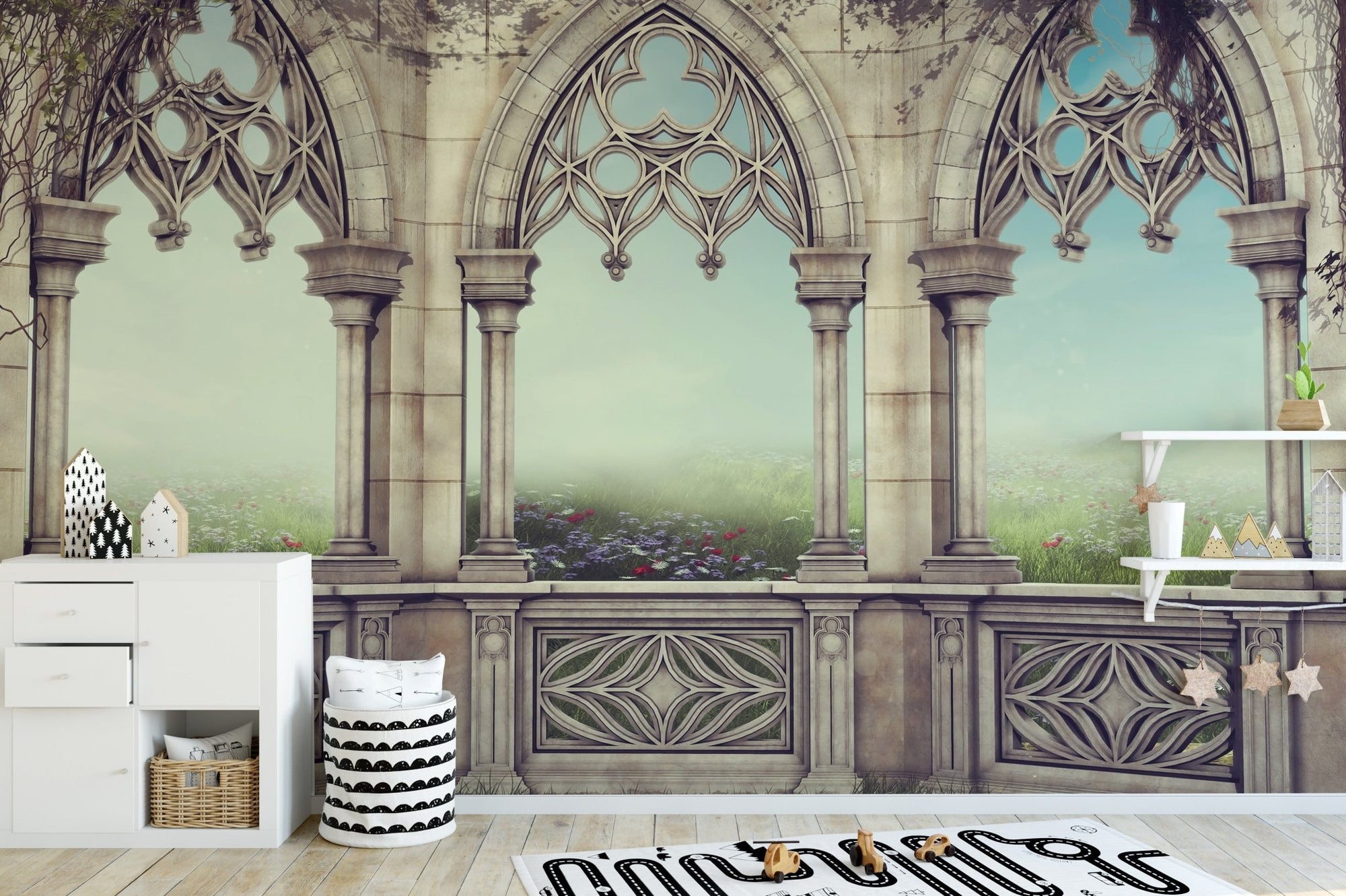 Gothic stone arch serenity wall mural in a modern playroom with white cabinets.