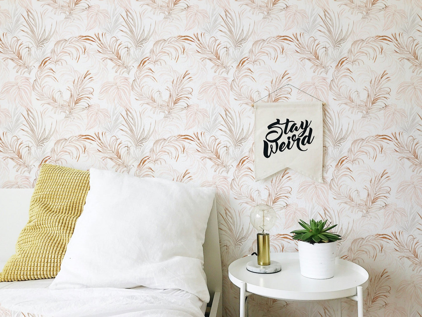 Bedroom accent wallpaper with soft palm branch motifs.