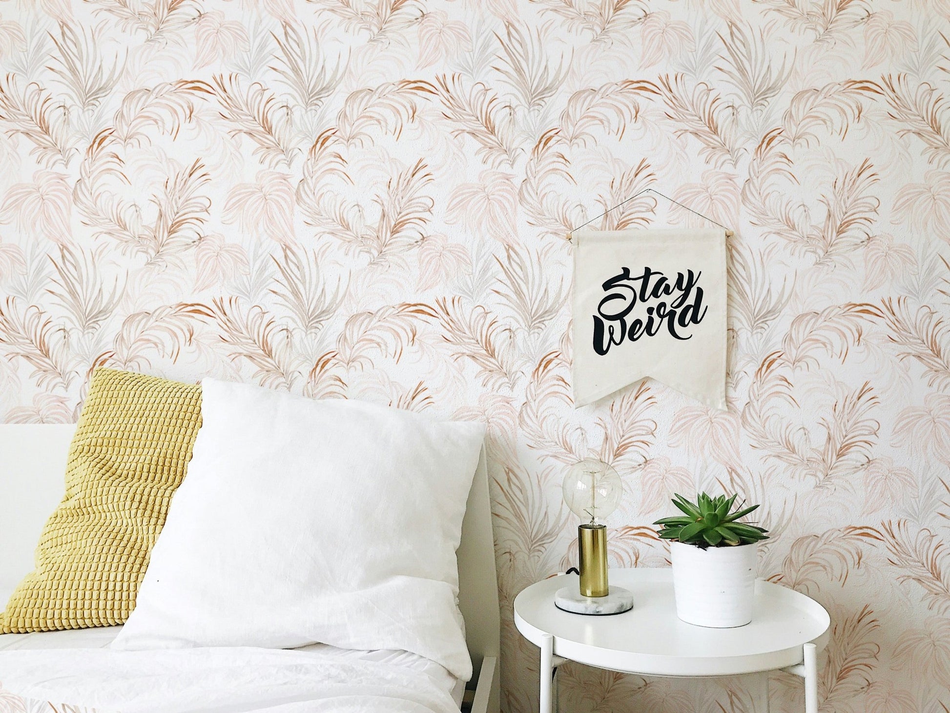 Bedroom accent wallpaper with soft palm branch motifs.