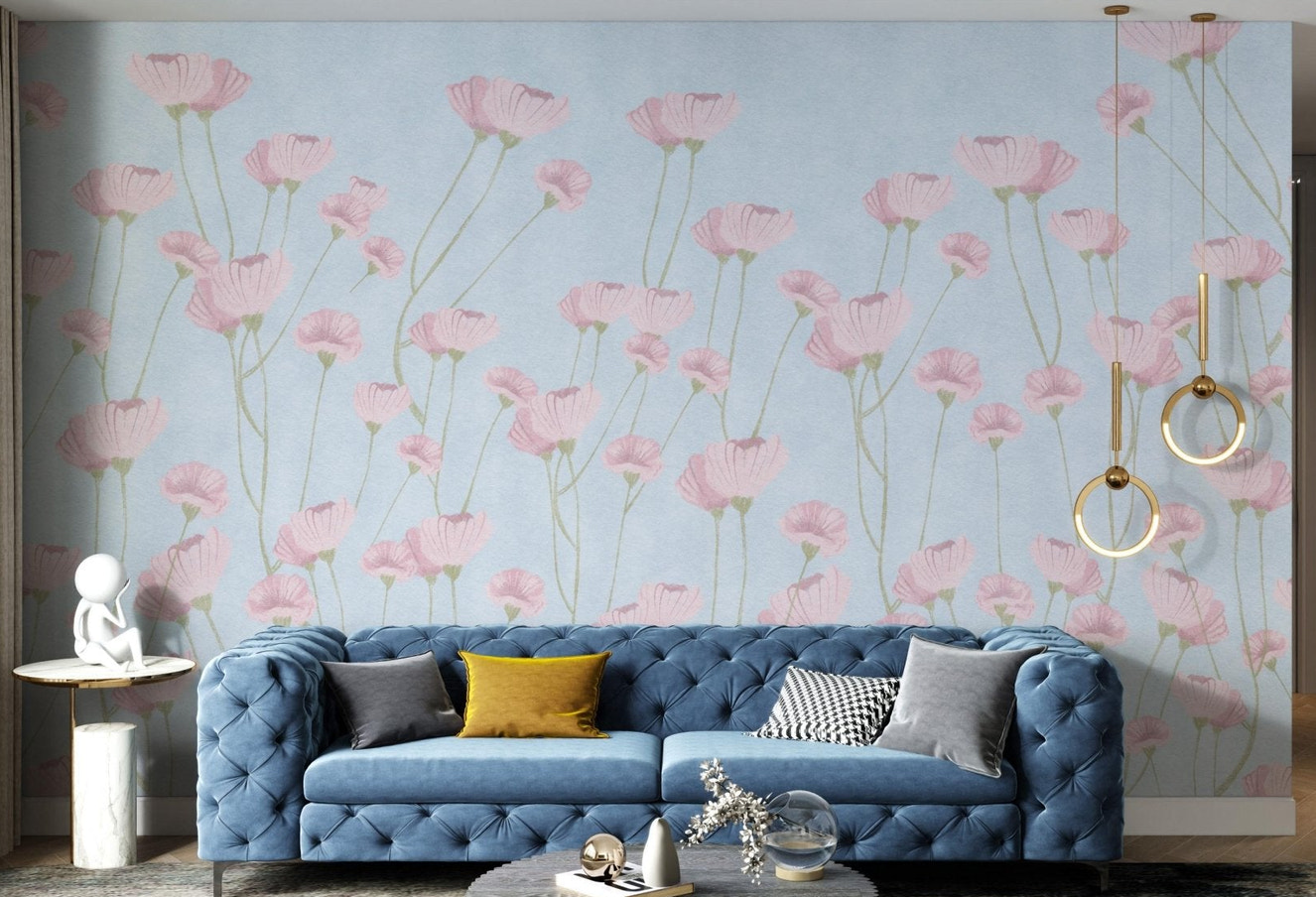 Soft pink floral wall mural on a textured light blue background surface.