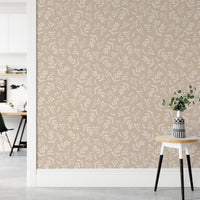 Seamless foliage wallpaper in a bright hallway with a small stool.
