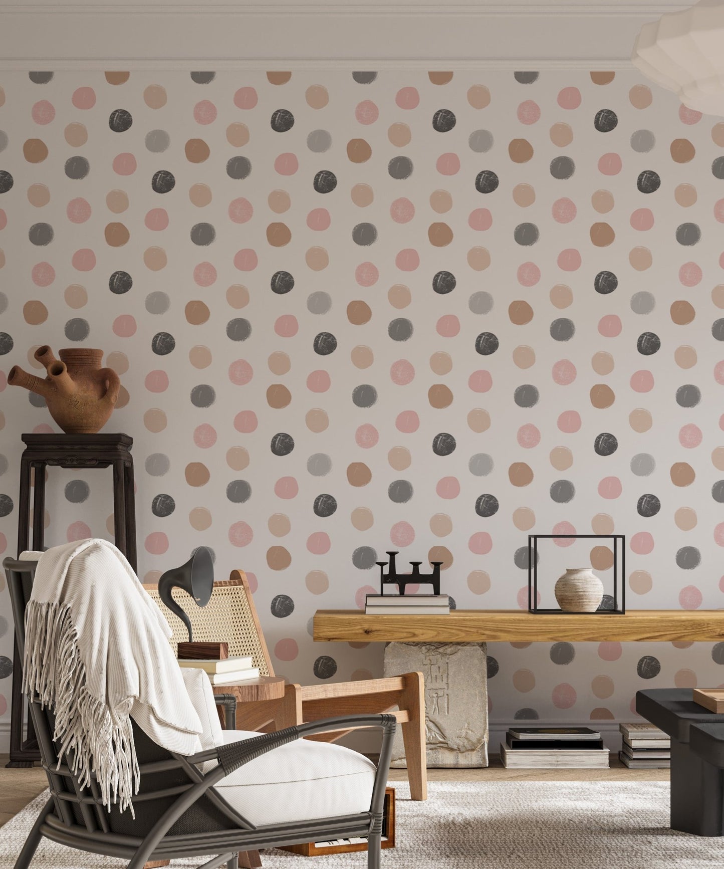 Neutral tone polka dot wallpaper in a home office with a black chair