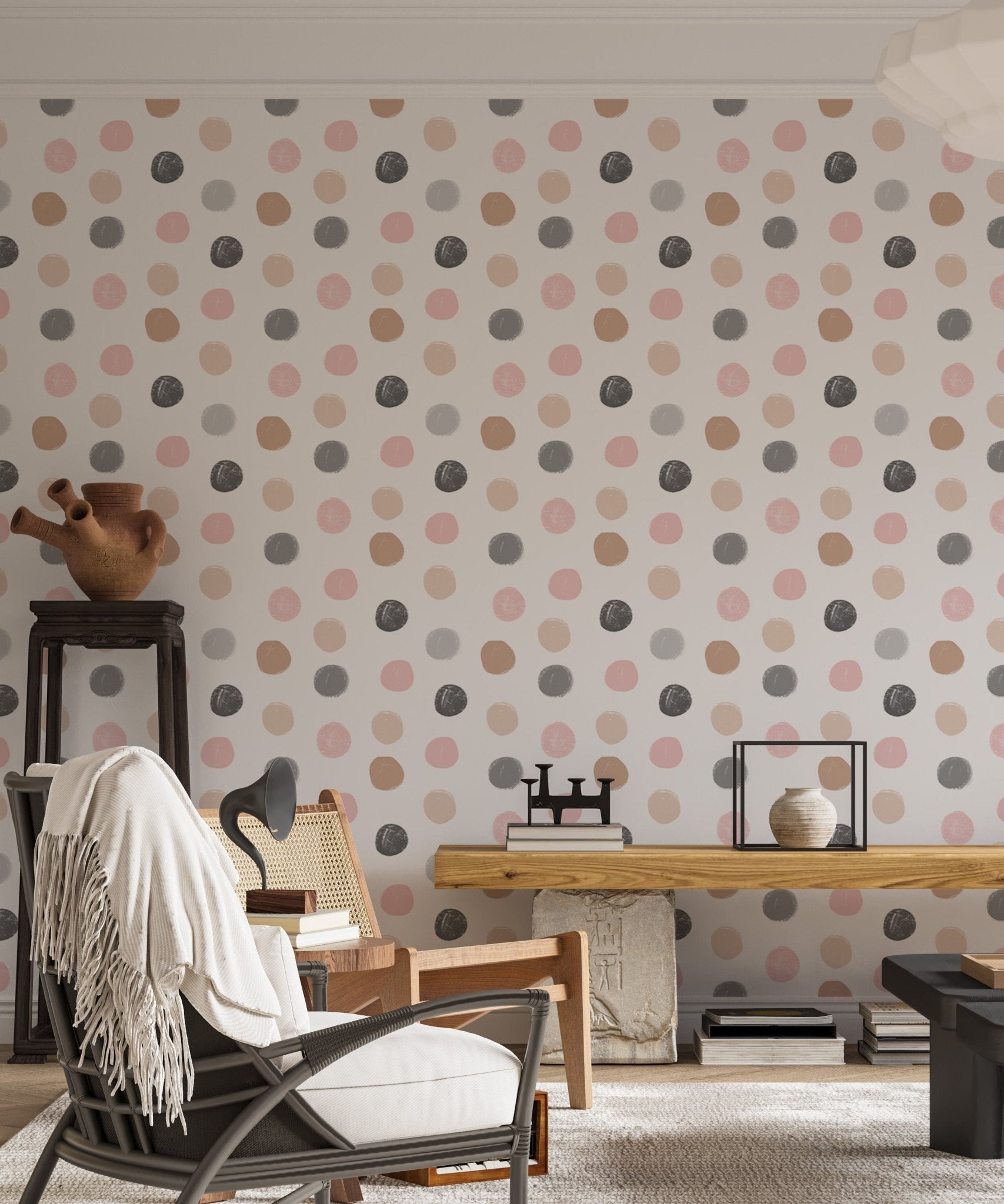 Neutral tone polka dot wallpaper in a home office with a black chair